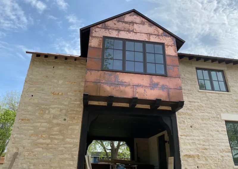 Copper metal panel facade on a stone building for Skylight Installation in Elk Grove