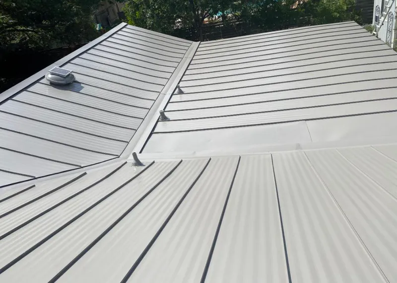 Solar attic fan installed on a metal roof for Roof Ventilation in Elk Grove
